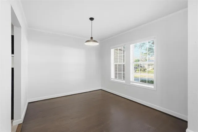 a view of an empty room with windows