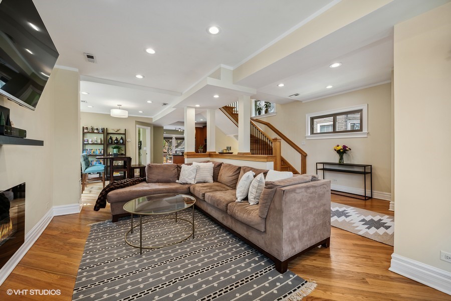 4340 North Harding Avenue Chicago, IL 60618 - Photo 3 of 14 a living room with furniture and a flat screen tv
