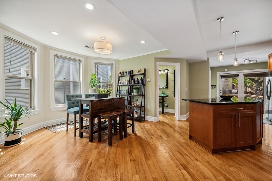 4340 North Harding Avenue Chicago, IL 60618 - Photo 4 of 14 a view of a dining room with furniture and wooden floor