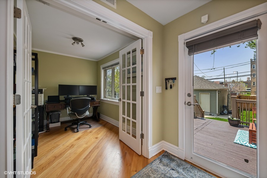 4340 North Harding Avenue Chicago, IL 60618 - Photo 6 of 14 a workspace with wooden floor and furniture