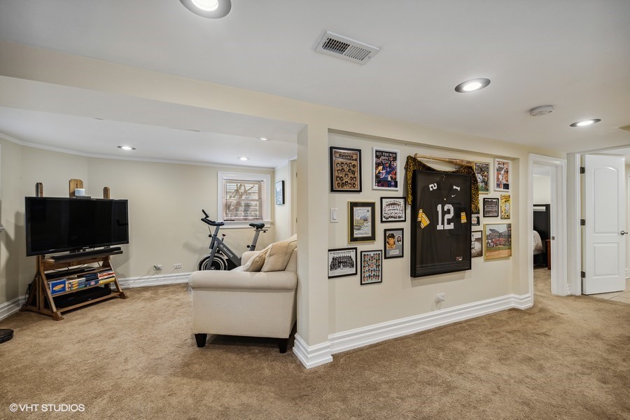 4340 North Harding Avenue Chicago, IL 60618 - Photo 9 of 14 a living room with furniture and a flat screen tv