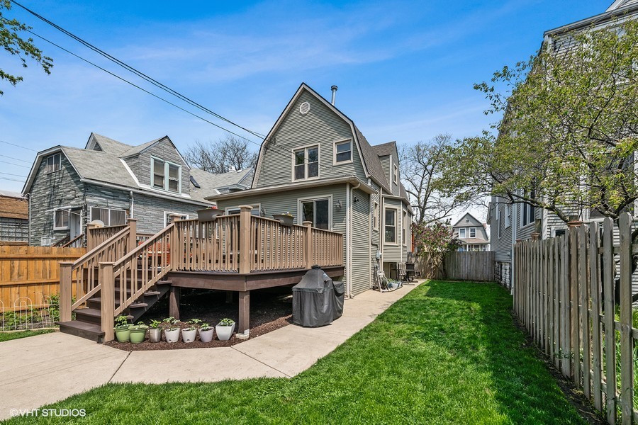 4340 North Harding Avenue Chicago, IL 60618 - Photo 10 of 14 a view of house with yard outdoor seating and entertaining space