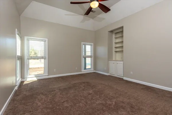 a kitchen with stainless steel appliances kitchen island granite countertop a refrigerator and a sink