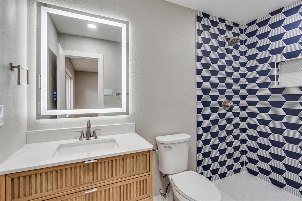 516 Ridgemont Drive Allen, TX 75002 - Photo 11 of 25 a bathroom with a sink toilet and shower