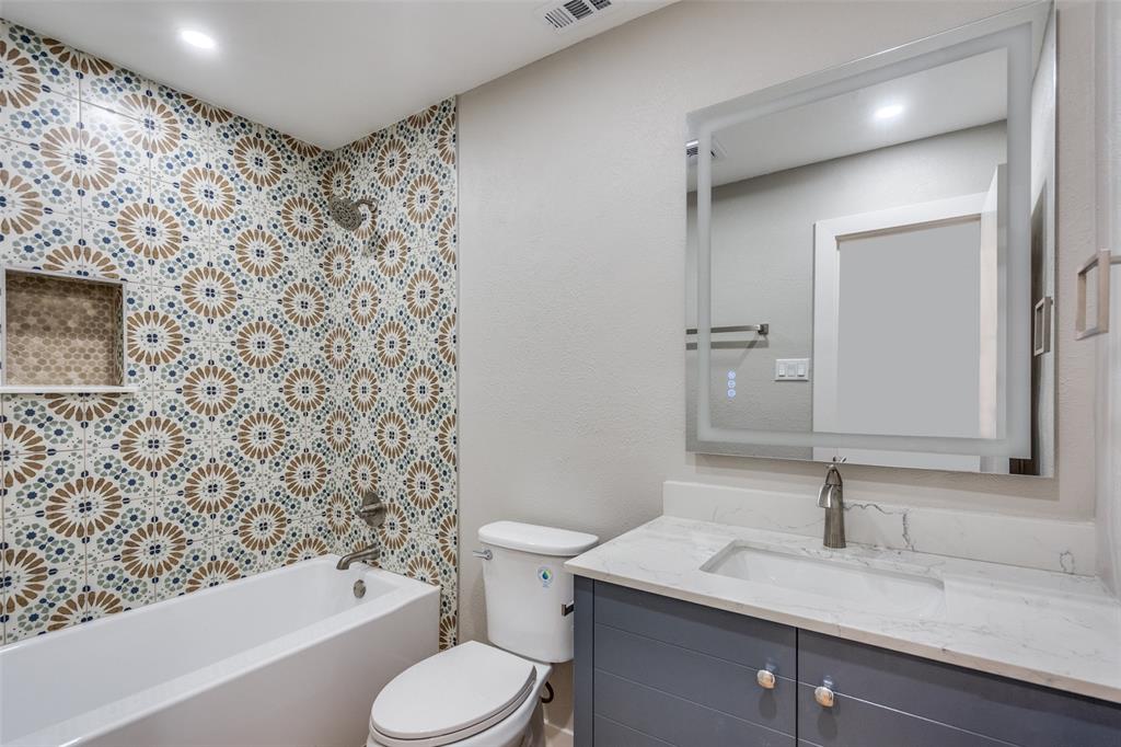 516 Ridgemont Drive Allen, TX 75002 - Photo 13 of 25 a bathroom with a sink toilet and shower