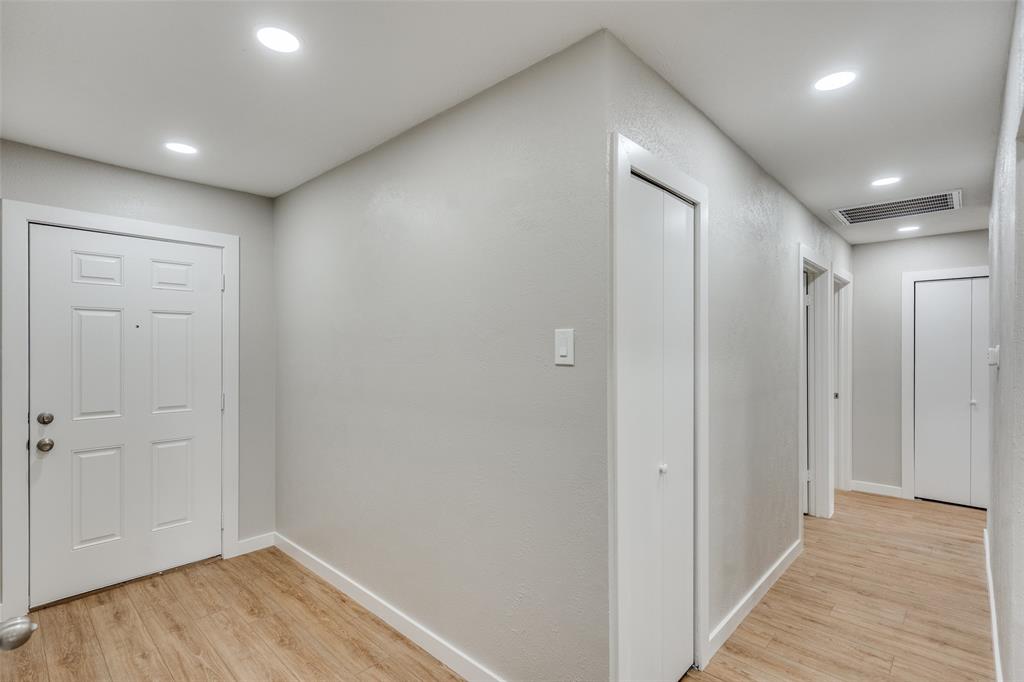 516 Ridgemont Drive Allen, TX 75002 - Photo 17 of 25 a view of hallway with wooden floor