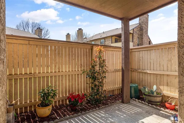 a view of a chairs and table in the balcony