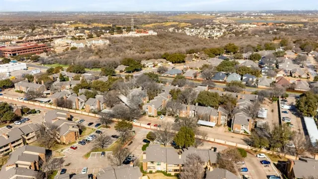 an aerial view of residential building with parking space