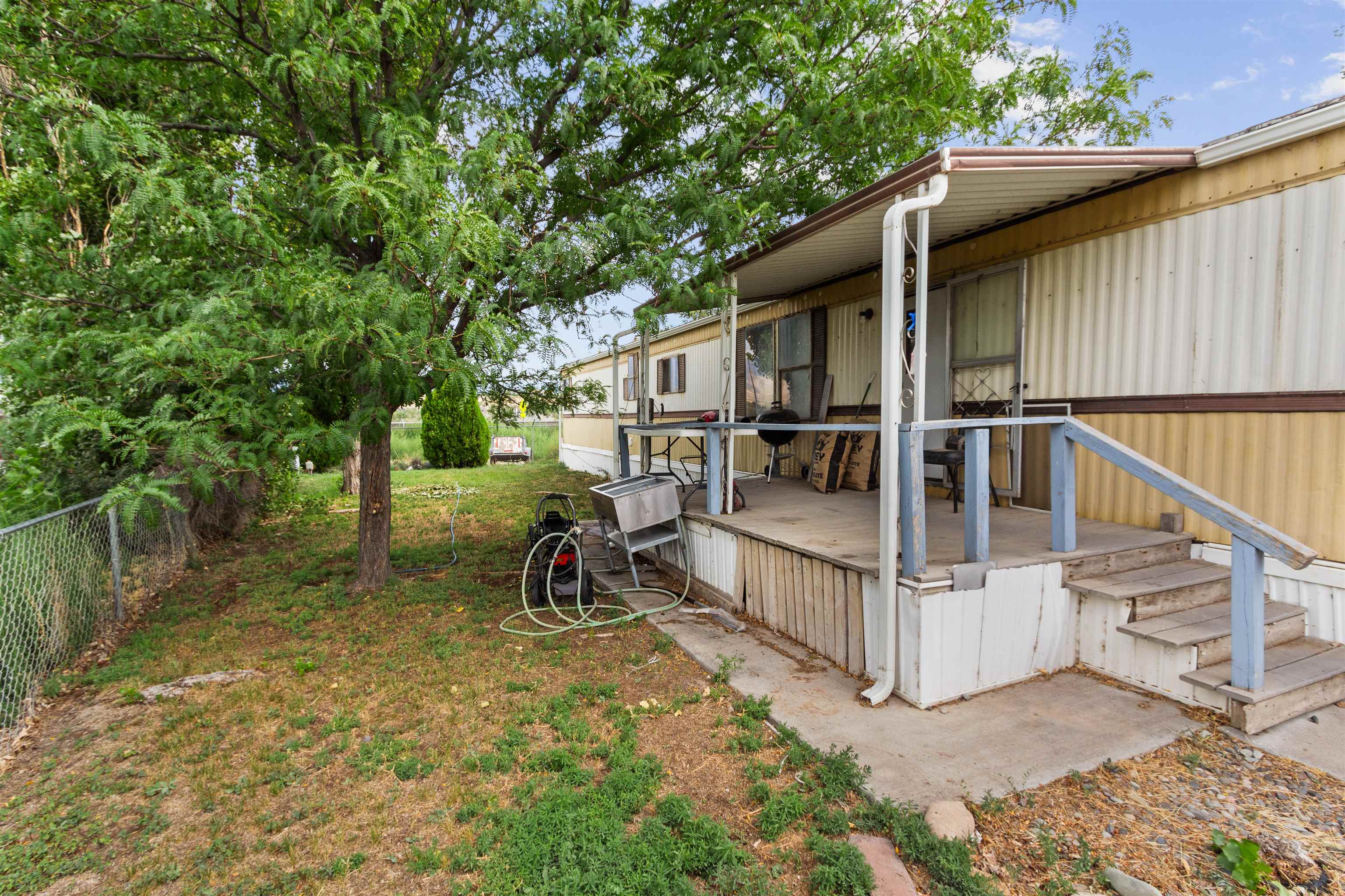 424 32 Road, Unit 262 Clifton, CO 81520 - Photo 3 of 16 a view of a house with backyard and sitting area