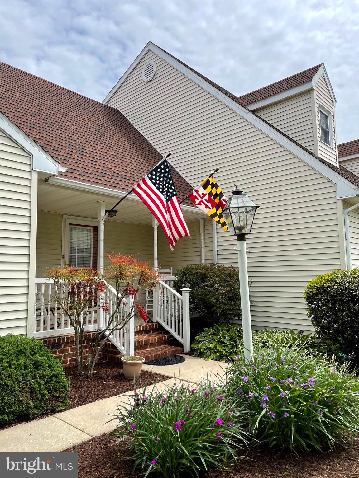 27950 Substation Road Denton, MD 21629 - Photo 2 of 80 Covered porch seating area looks to front yard.