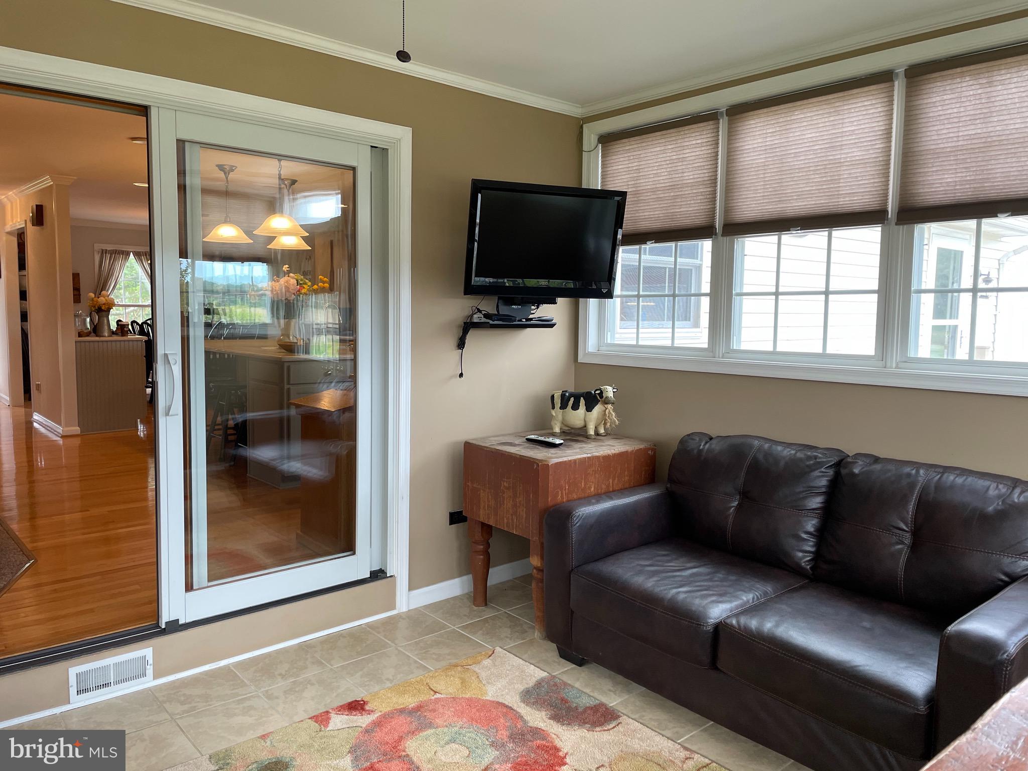 27950 Substation Road Denton, MD 21629 - Photo 21 of 80 Heated & AC sun room off Kitchen/Living Room.