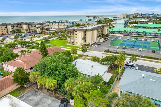 an aerial view of a residential building and city view