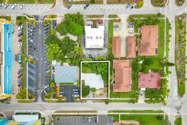 a view of gym equipment with wooden floor