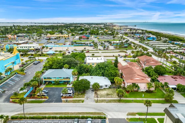 an aerial view of residential building and lake