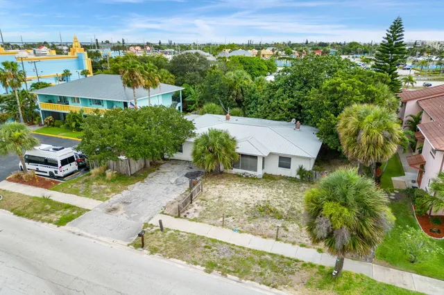 an aerial view of a house with a garden