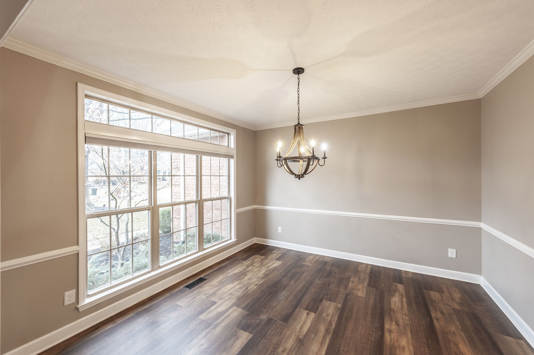 1133 Inneswood Drive Gallatin, TN 37066 - Photo 16 of 57 a view of empty room with wooden floor and fan