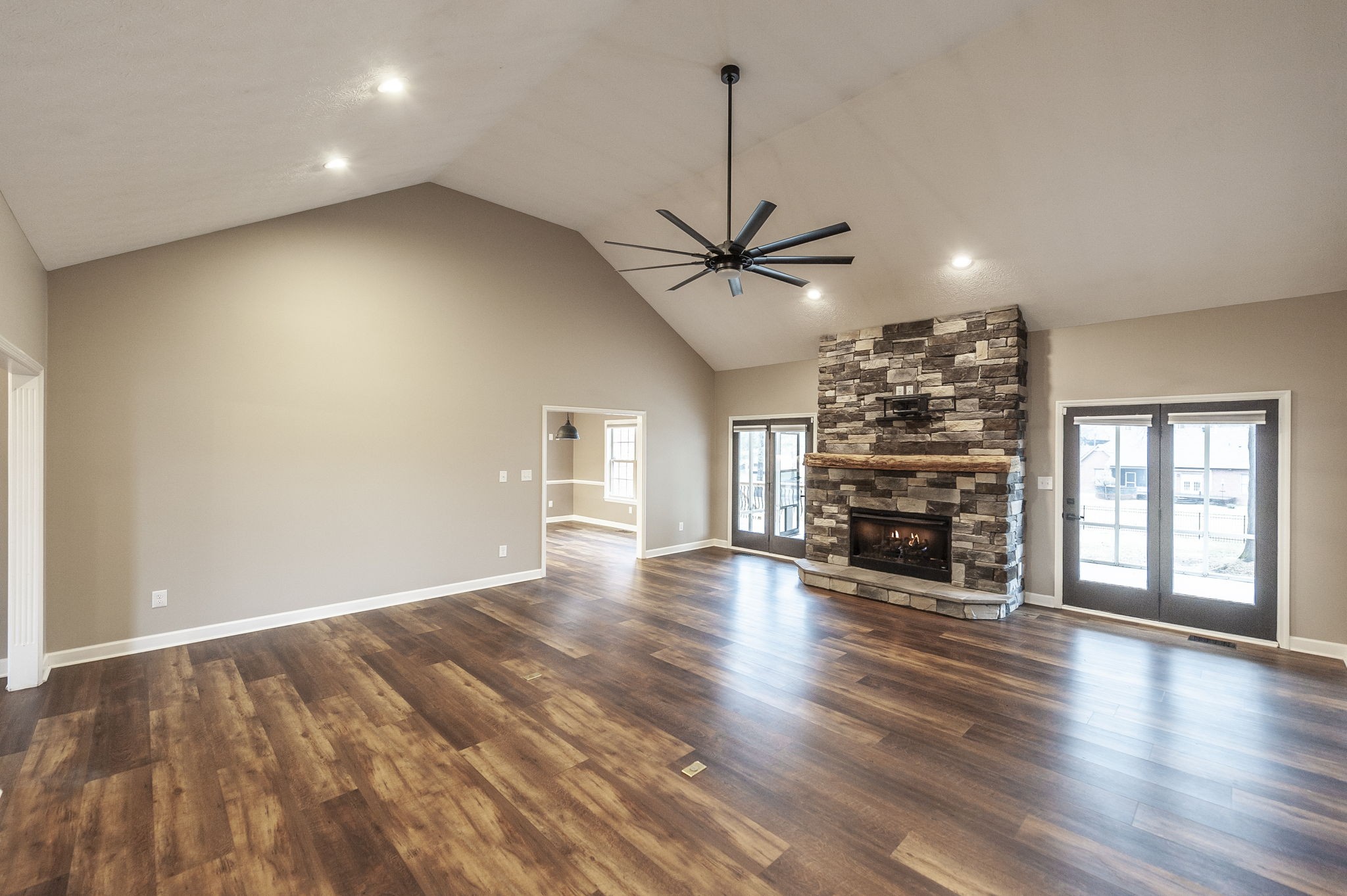 1133 Inneswood Drive Gallatin, TN 37066 - Photo 21 of 57 an empty room with wooden floor chandelier and windows