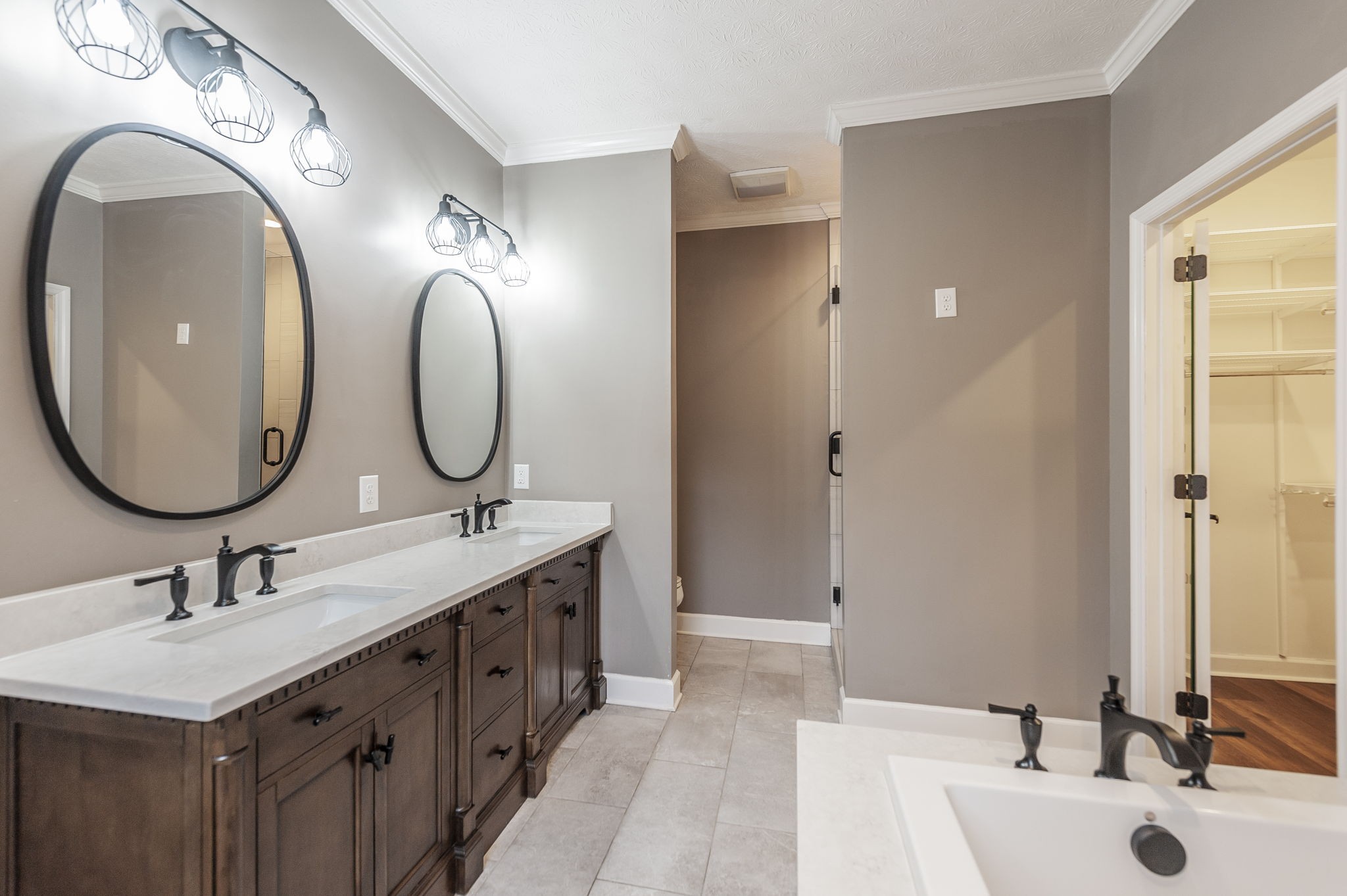 1133 Inneswood Drive Gallatin, TN 37066 - Photo 26 of 57 a bathroom with a double vanity sink and a mirror