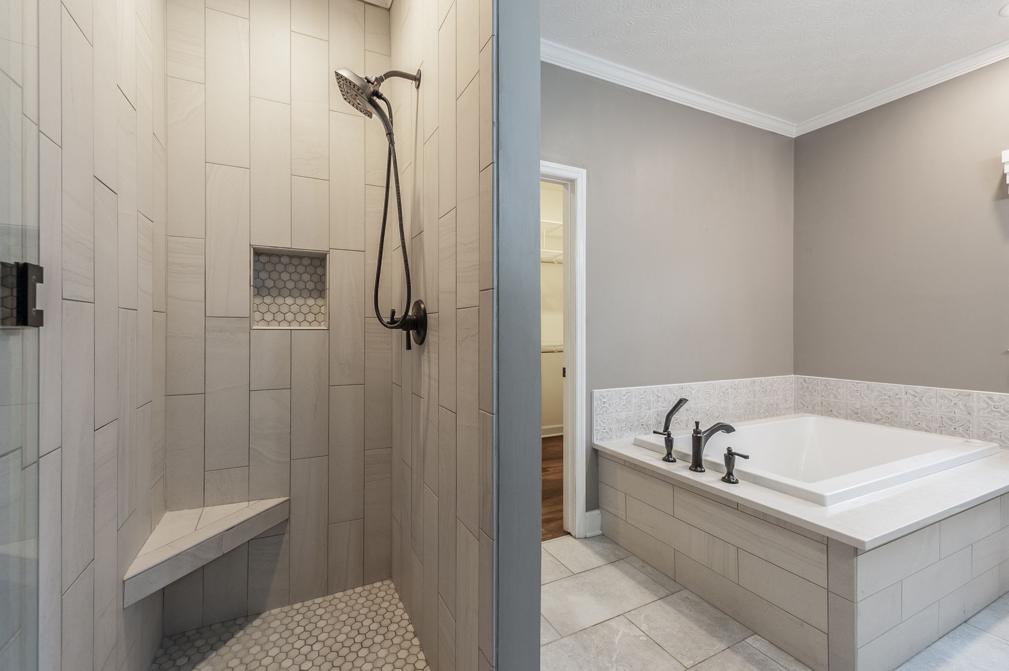 1133 Inneswood Drive Gallatin, TN 37066 - Photo 28 of 57 a bathroom with a tub a toilet and a shower