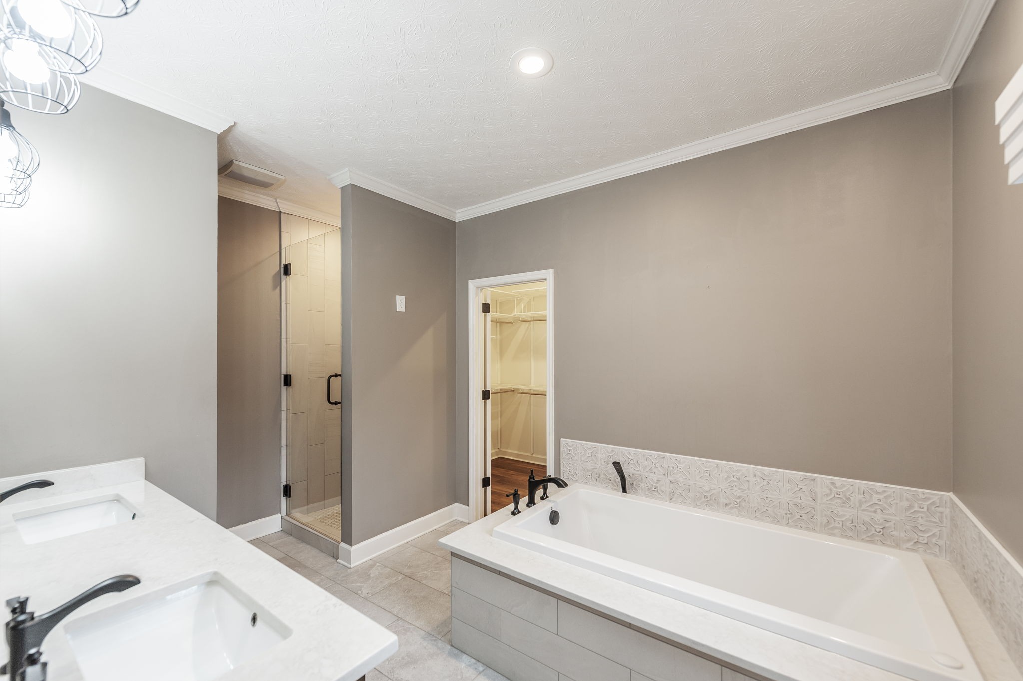 1133 Inneswood Drive Gallatin, TN 37066 - Photo 29 of 57 a bathroom with a tub sink and mirror