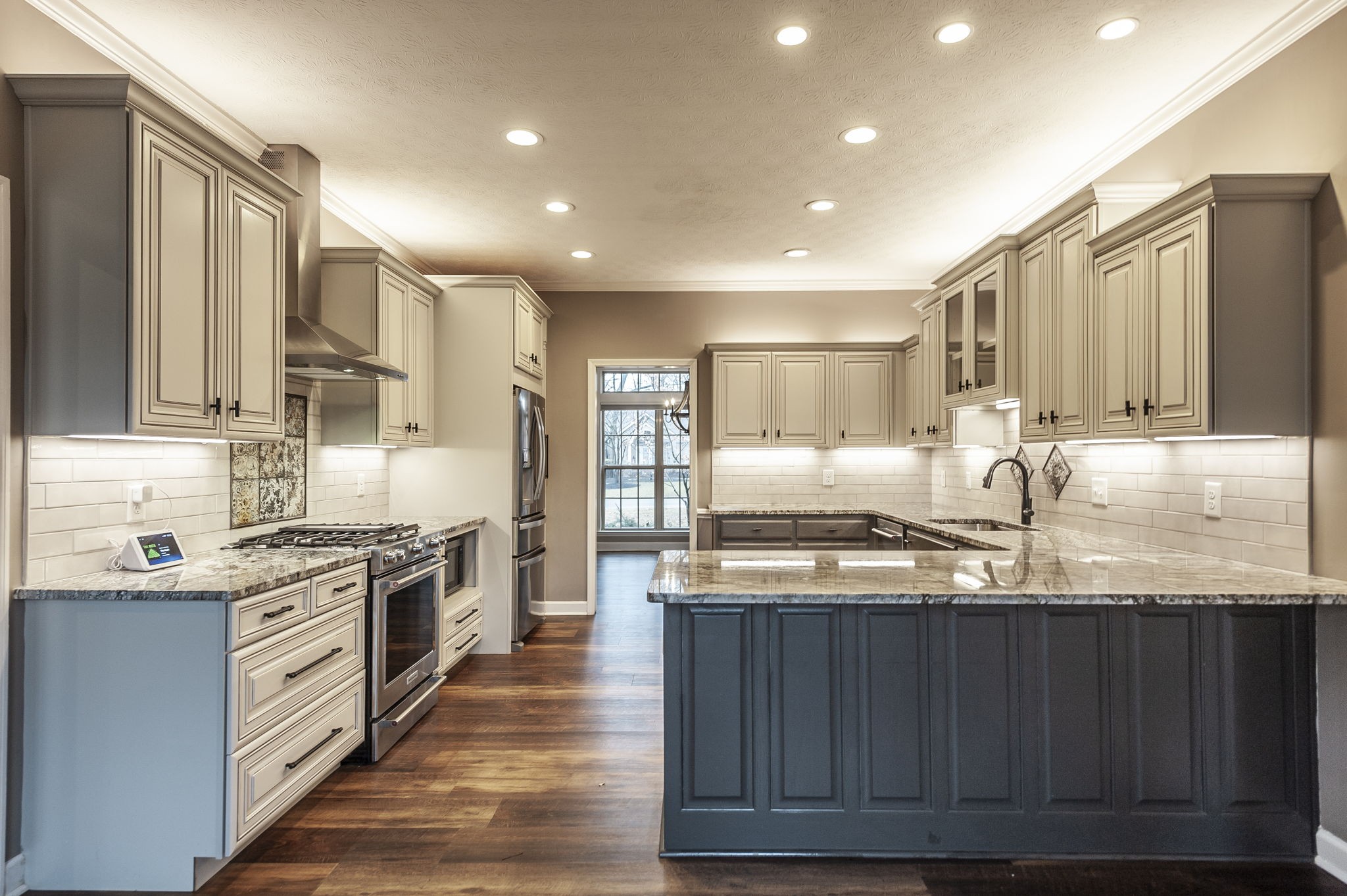 1133 Inneswood Drive Gallatin, TN 37066 - Photo 4 of 57 a kitchen with stainless steel appliances granite countertop a sink stove and refrigerator