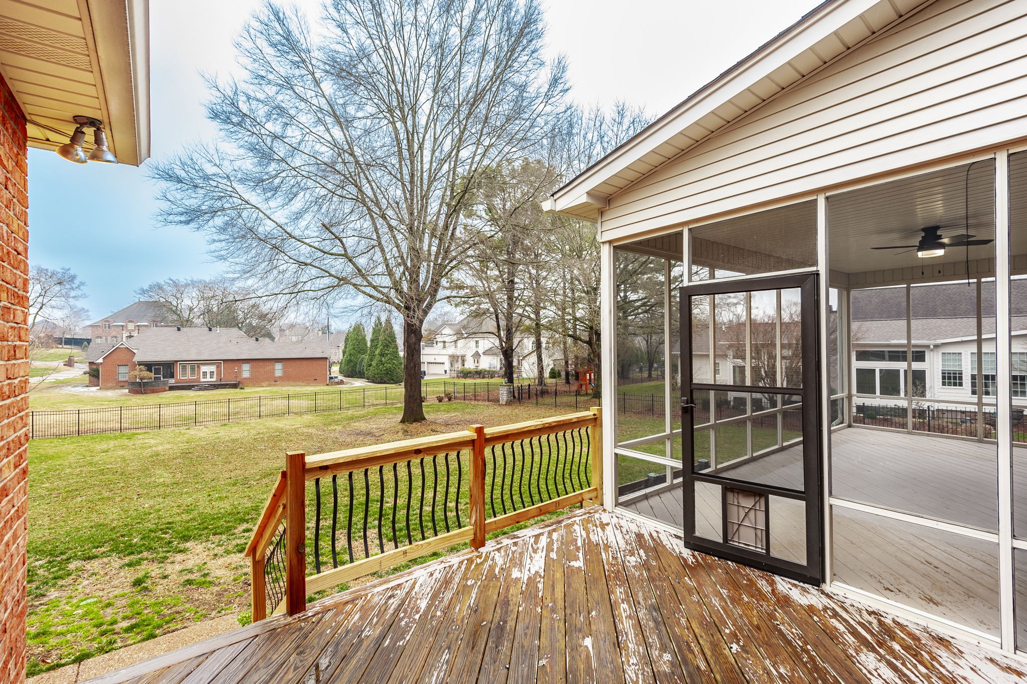 1133 Inneswood Drive Gallatin, TN 37066 - Photo 42 of 57 a view of a balcony with floor to ceiling windows and wooden floor