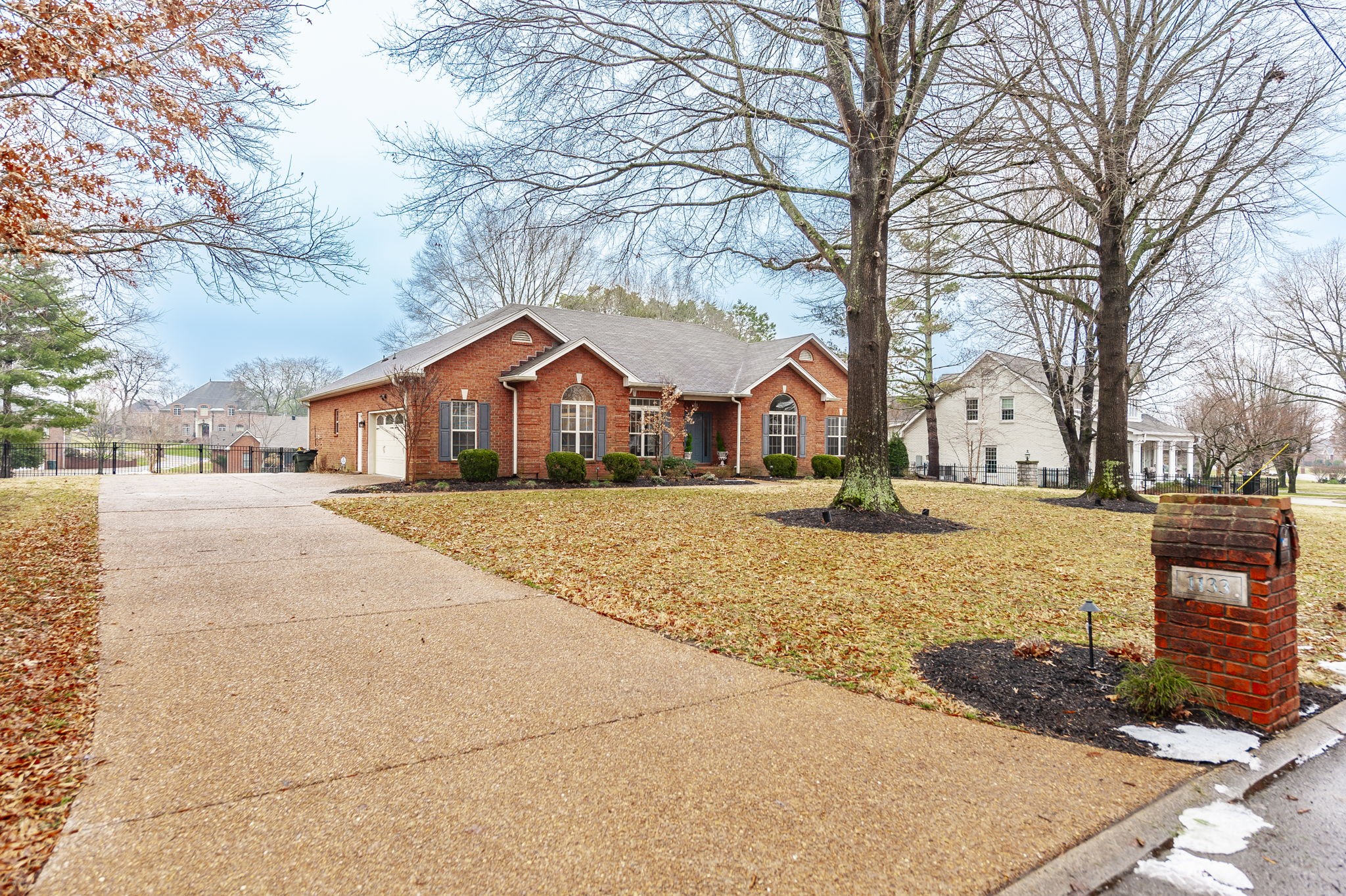 1133 Inneswood Drive Gallatin, TN 37066 - Photo 47 of 57 a front view of house with yard and trees