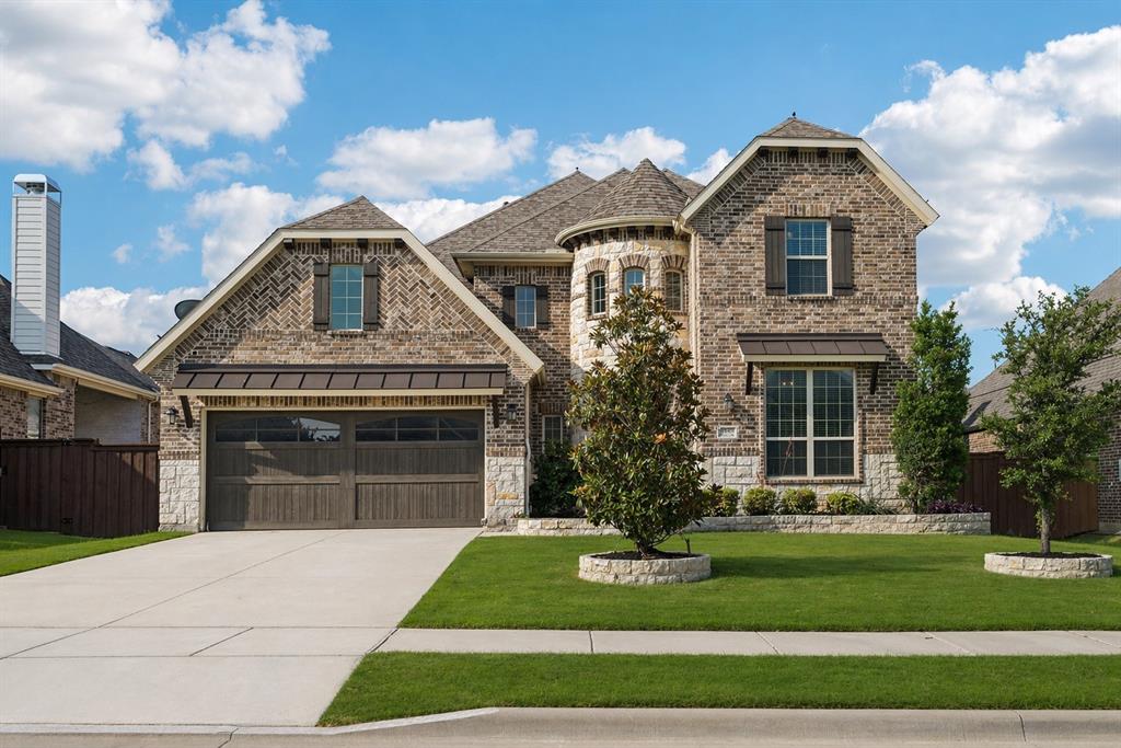 4861 Verbena Way Prosper, TX 75078 - Photo 1 of 38 a front view of a house with a garden