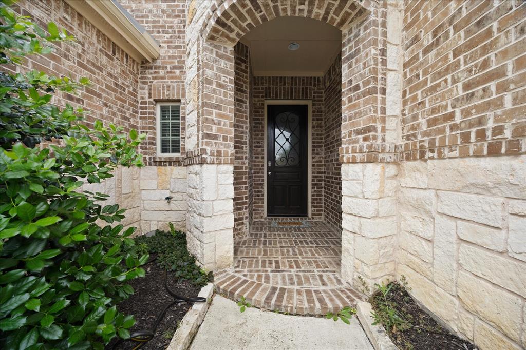 4861 Verbena Way Prosper, TX 75078 - Photo 2 of 38 a front view of a house with a garden