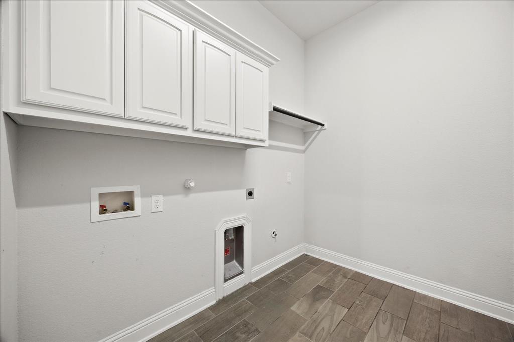 4861 Verbena Way Prosper, TX 75078 - Photo 21 of 38 a view of storage and utility room with wooden floor