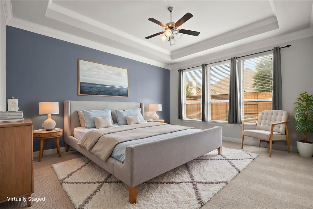 4861 Verbena Way Prosper, TX 75078 - Photo 22 of 38 a spacious bedroom with a large bed and a large window