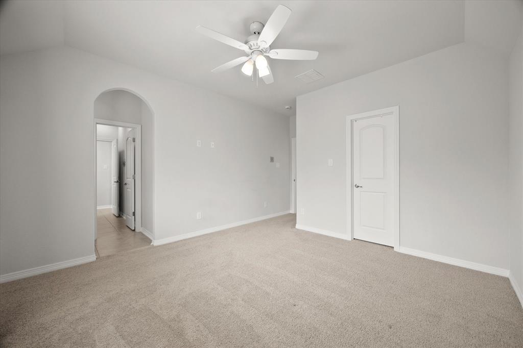 4861 Verbena Way Prosper, TX 75078 - Photo 26 of 38 an empty room with a ceiling fan and a window