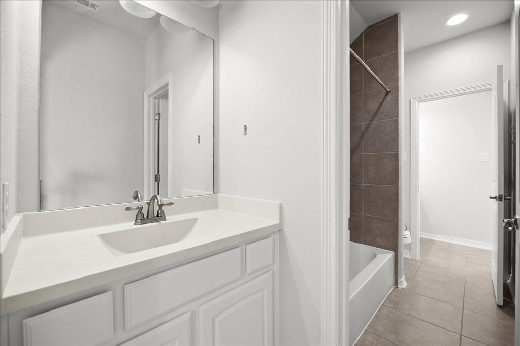 4861 Verbena Way Prosper, TX 75078 - Photo 29 of 38 a bathroom with a sink and a bathtub