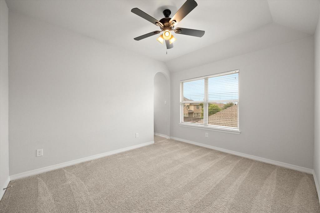 4861 Verbena Way Prosper, TX 75078 - Photo 30 of 38 an empty room with windows and fan