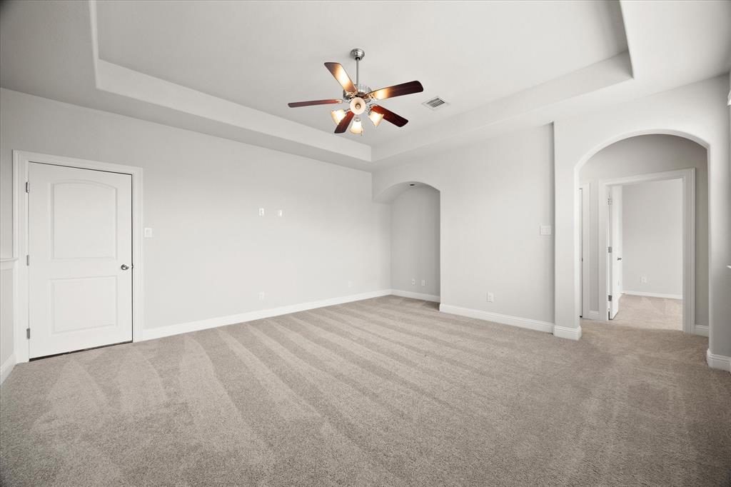 4861 Verbena Way Prosper, TX 75078 - Photo 32 of 38 a view of an empty room with a ceiling fan
