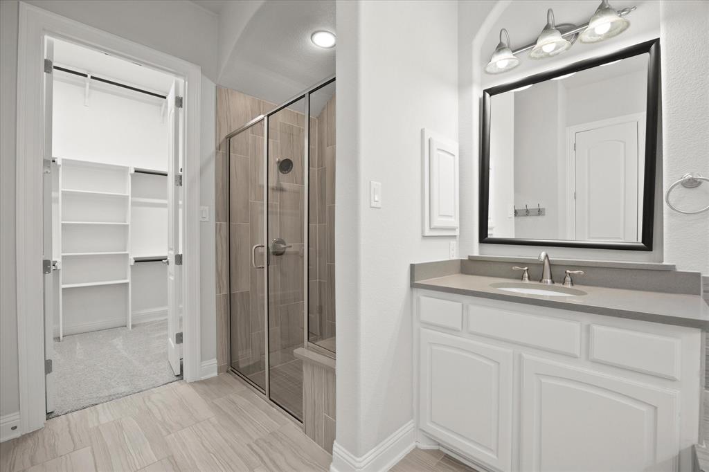 4861 Verbena Way Prosper, TX 75078 - Photo 33 of 38 a bathroom with a double vanity sink mirror and