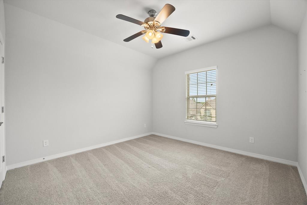 4861 Verbena Way Prosper, TX 75078 - Photo 34 of 38 an empty room with a window and a fan