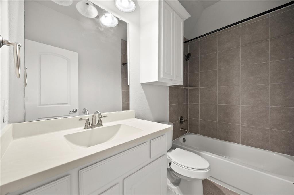 4861 Verbena Way Prosper, TX 75078 - Photo 35 of 38 a bathroom with a sink a toilet and a bathtub