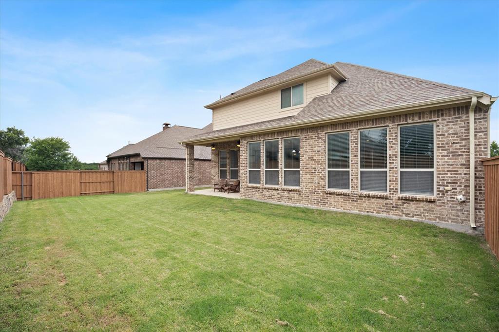 4861 Verbena Way Prosper, TX 75078 - Photo 37 of 38 a large house with a big yard and large trees