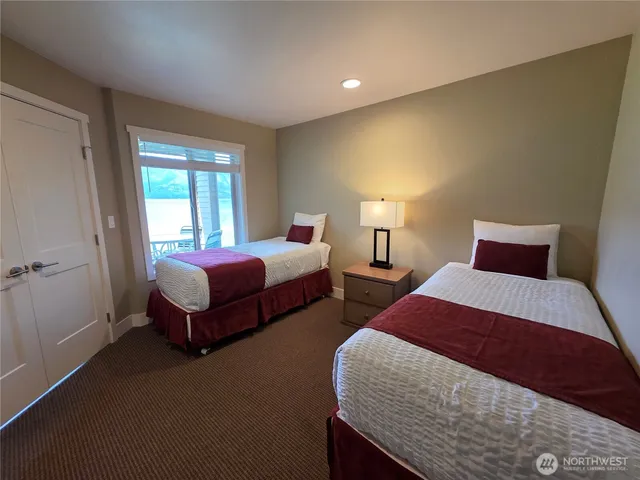 a bedroom with bed and window