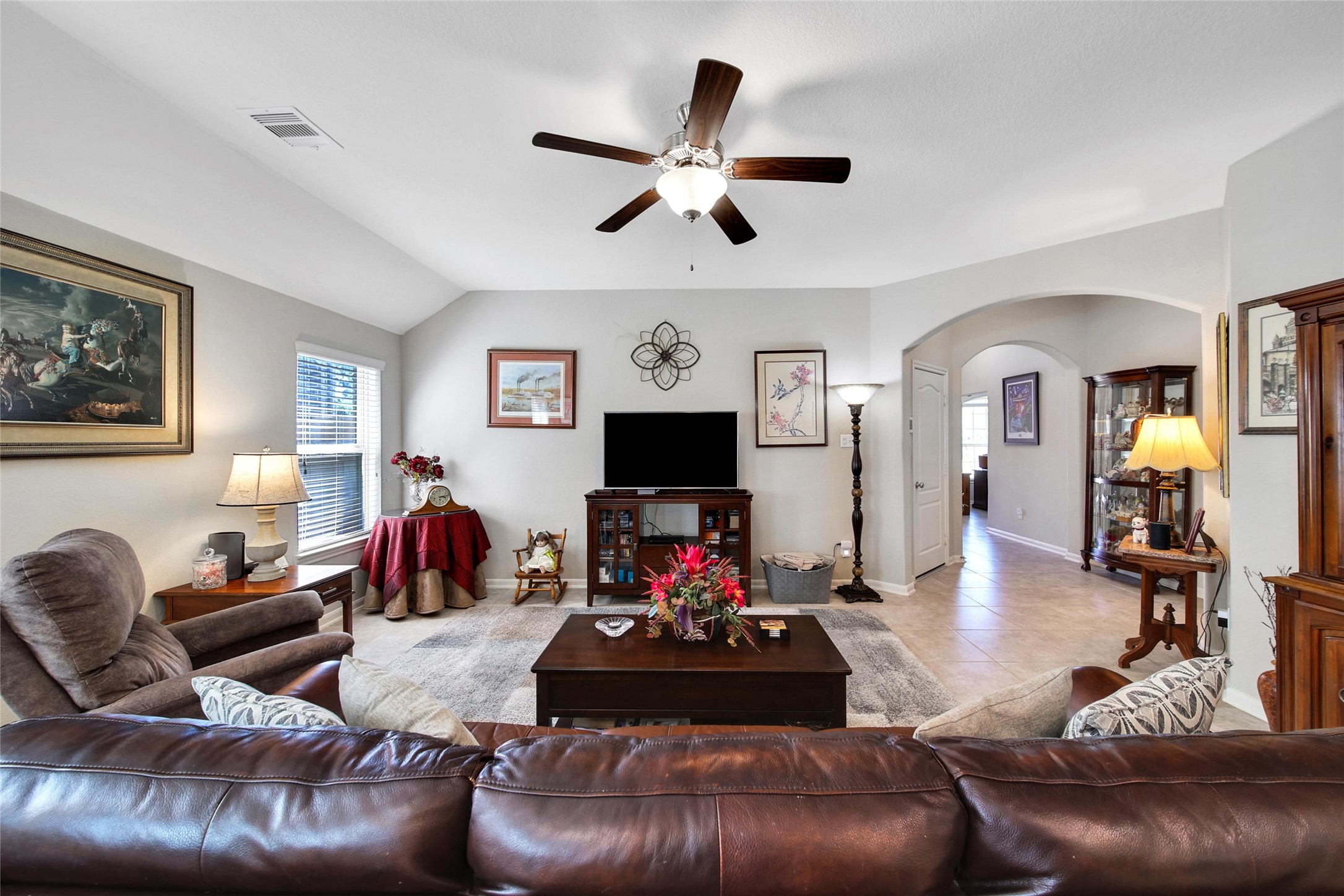 214 Pleasant Hill Way Conroe, TX 77304 - Photo 10 of 43 The beautiful family room offers space for everyone to gather.