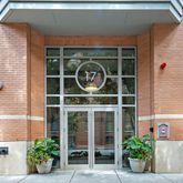 a front view of a house with plants