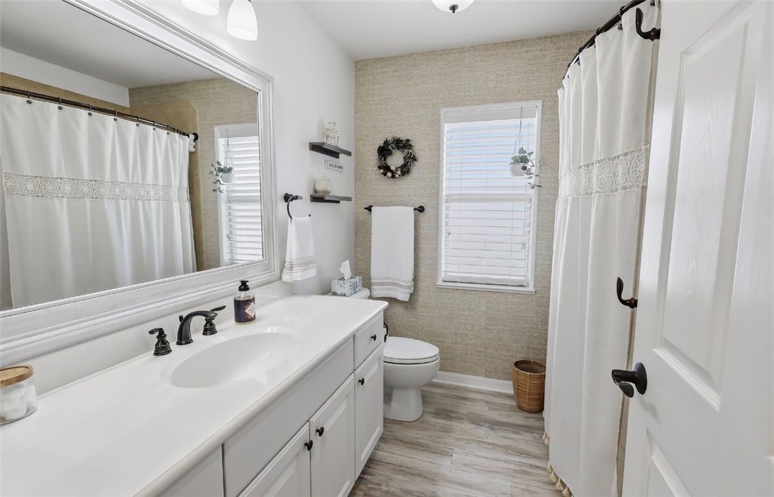 1771 Mistletoe Street Sebastian, FL 32958 - Photo 24 of 36 a bathroom with a double vanity sink toilet and shower