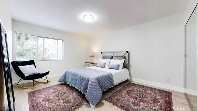 a bedroom with a bed and window