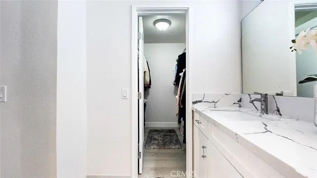 a bedroom with a bed and a table in it