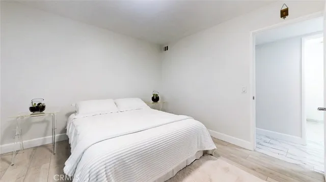 a bedroom with a bed and a desk