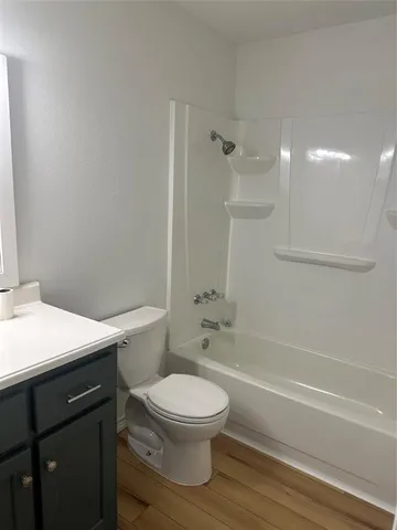 a bathroom with a toilet a sink and a shower