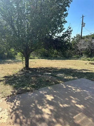 a view of a lake with a yard