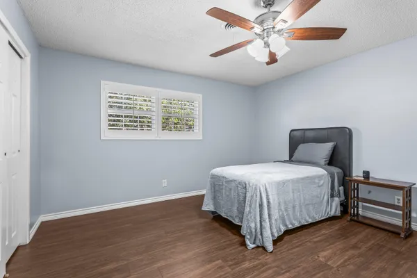 a bed room with a bed and a chandelier