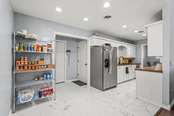 a view of kitchen with furniture and cabinet